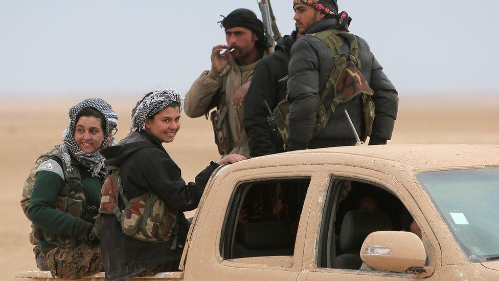 Syrian Democratic Forces (SDF) fighters ride on a vehicle north of Raqqa, Syria (5 February 2017)