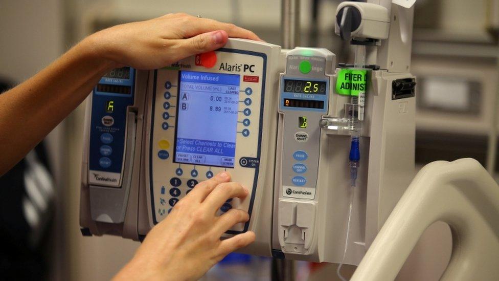 a nurse works on a computer