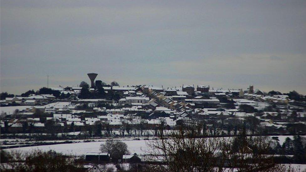 Rathfriland on the hill, in the snow, by Andrew McCracken