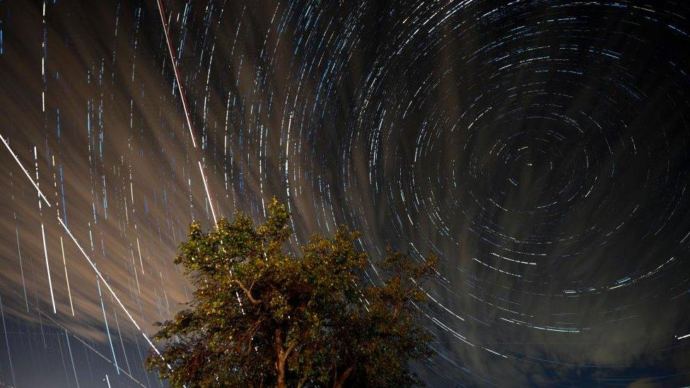 More than 300 stacked digital images of long exposures show Perseid meteors and airplanes crossing the sky near the city of Kumanovo, Republic of North Macedonia on 12 August 2023