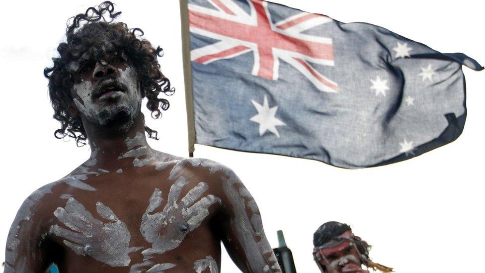 Aboriginal performers guide the Indigenous and Torres Straight Islander war veteran march on ANZAC Day in Sydney's Redfern on April 25, 2008