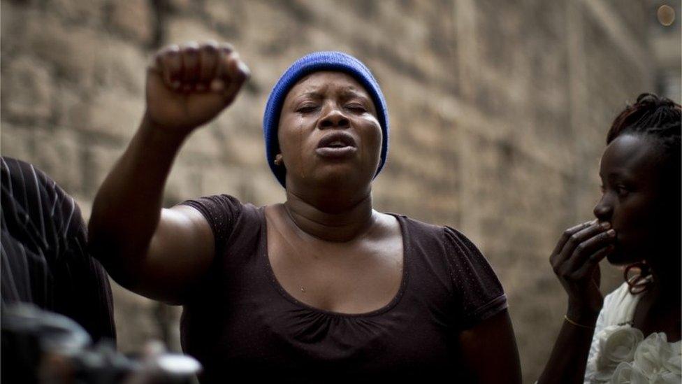 A woman cries after a woman who had been trapped for six days in the rubble of a collapsed building was freed, in the Huruma area of Nairobi, Kenya - Thursday 5 May 2016