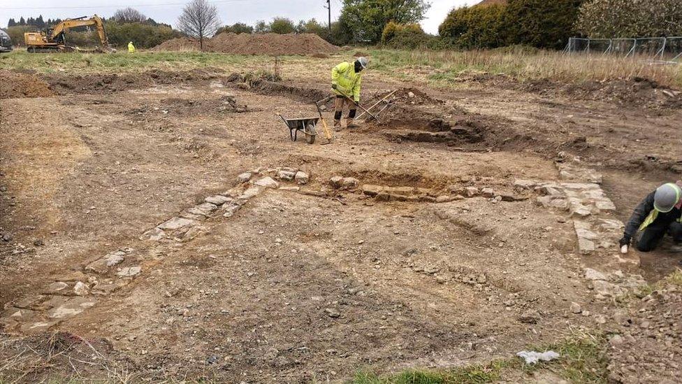 Archaeologist during a dig at Farm Lane, Fitzwilliam