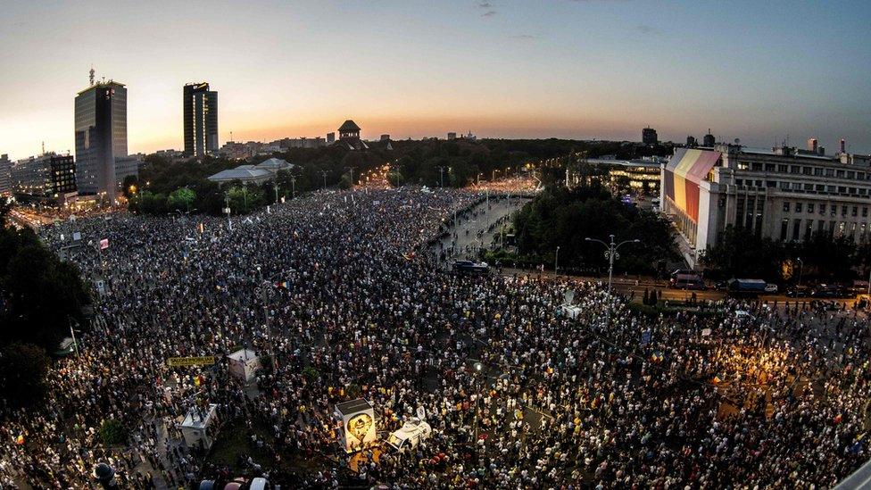 Demonstrators rally in an anti-government protest in front of the Romanian Government headquarters in Bucharest