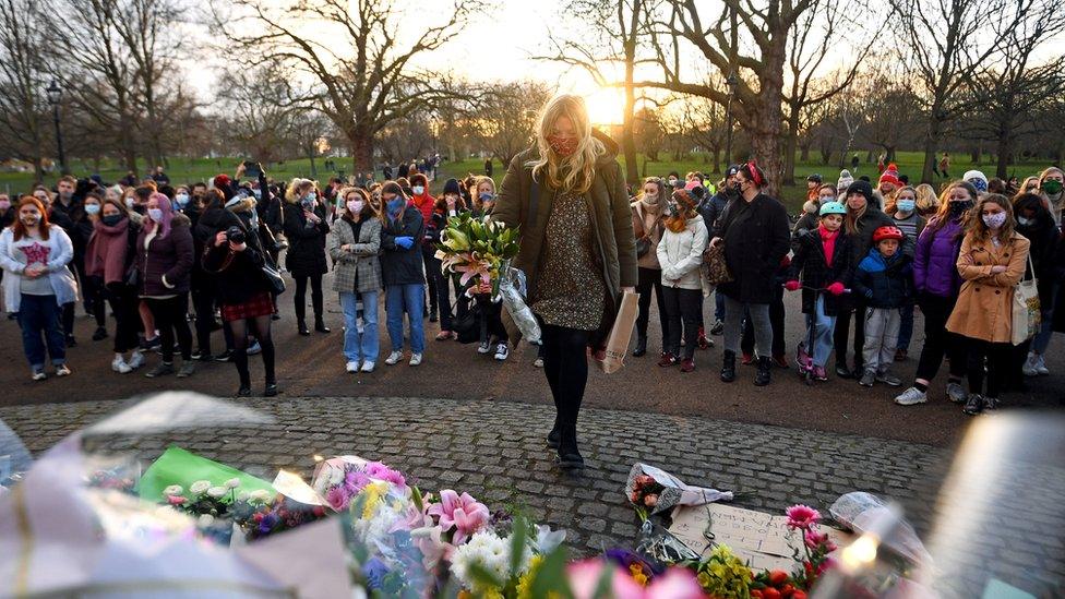 People gather at a memorial at Clapham Common