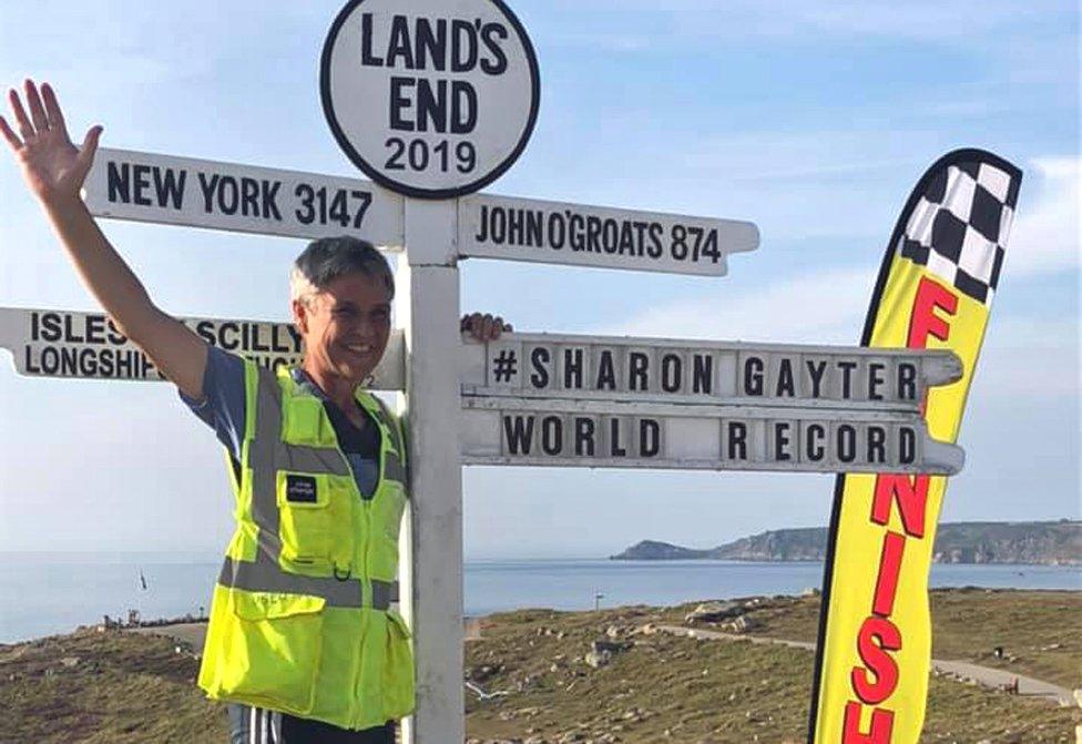 Sharon Gayter at the Land's End location sign