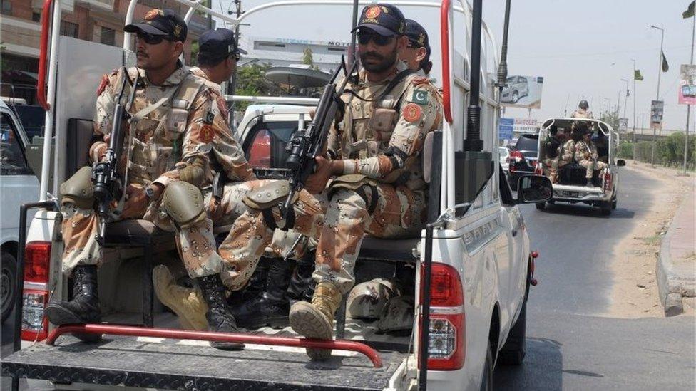 Pakistani paramilitary soldiers patrol a street in Karachi on June 4, 2014 following the arrest of Altaf Hussain, head of Pakistan's Muttahida Qaumi Movement (MQM) party, in London. (file photo June 2014)