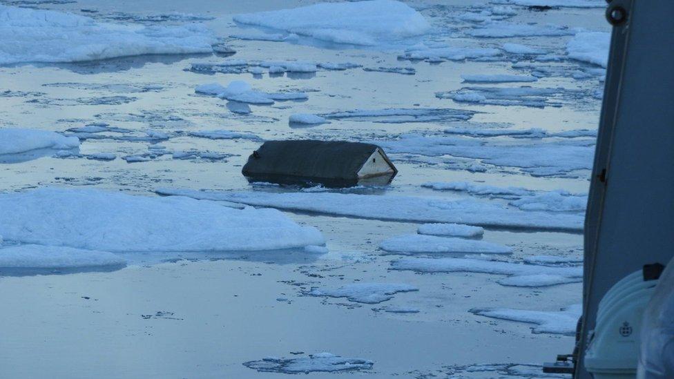 A home is seen submerged after a tsunami hit the village of Nuugaatsiaq, north-western Greenland