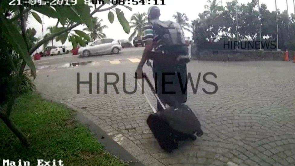 A man believed to be Western-educated bomber Abdul Latheef Mohamed Jameel (in striped shirt and cap) leaves the Taj Samudra hotel in Colombo, Sri Lanka April 21, 2019