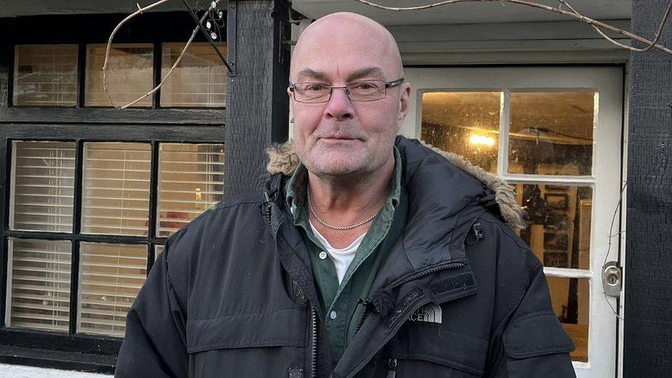 Nigel Dawson outside his home in Cambridgeshire.