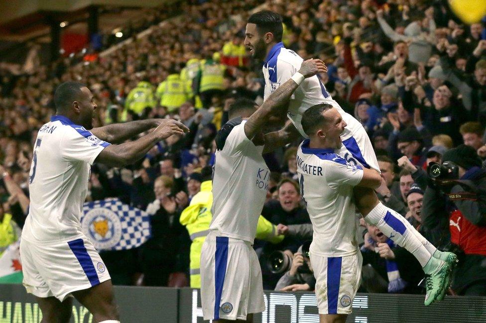 Riyad Mahrez is lifted by his teammates as he celebrates after scoring a goal during the English Premier League soccer match between Watford and Leicester City