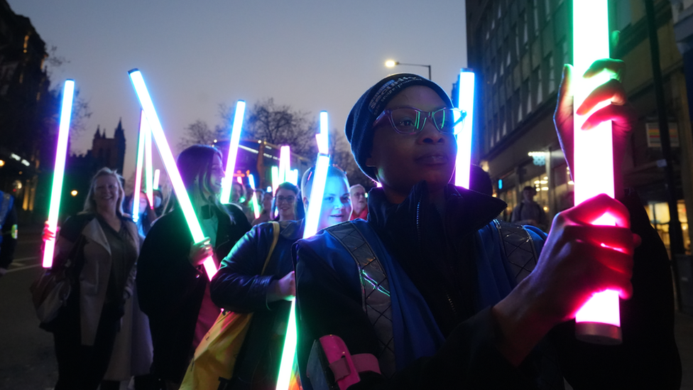 Parade with illuminated poles