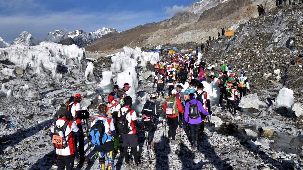 Large group of runners gathered on the slopes of Everest on 29 May 2016.