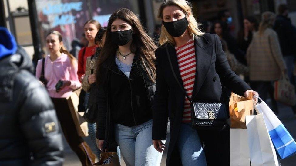 Shoppers wearing masks after lockdown easing