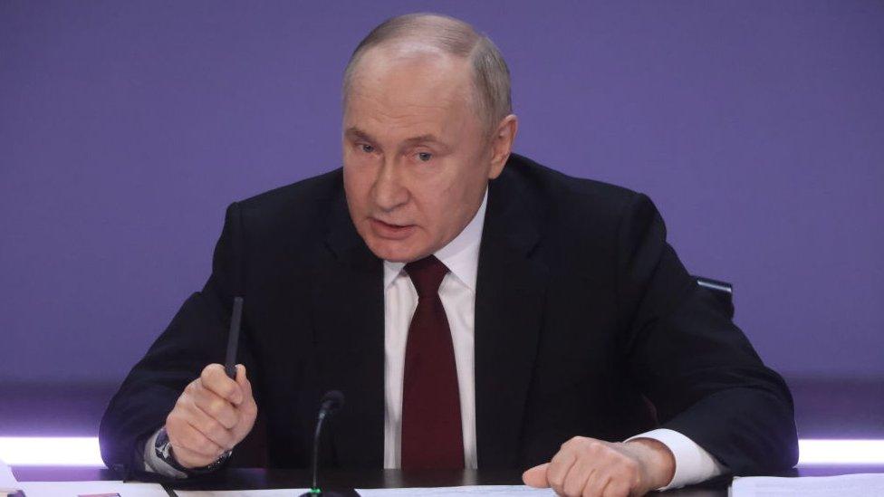 President Vladimir Putin speaking to reporters