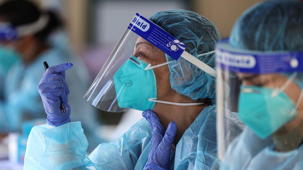 Healthcare worker wearing full protective gear in Melbourne