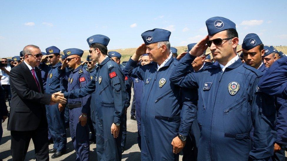 President Erdogan meets security personnel at police special forces HQ in Ankara