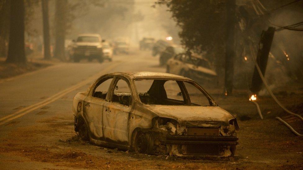 Abandoned and burned out car on side of the road