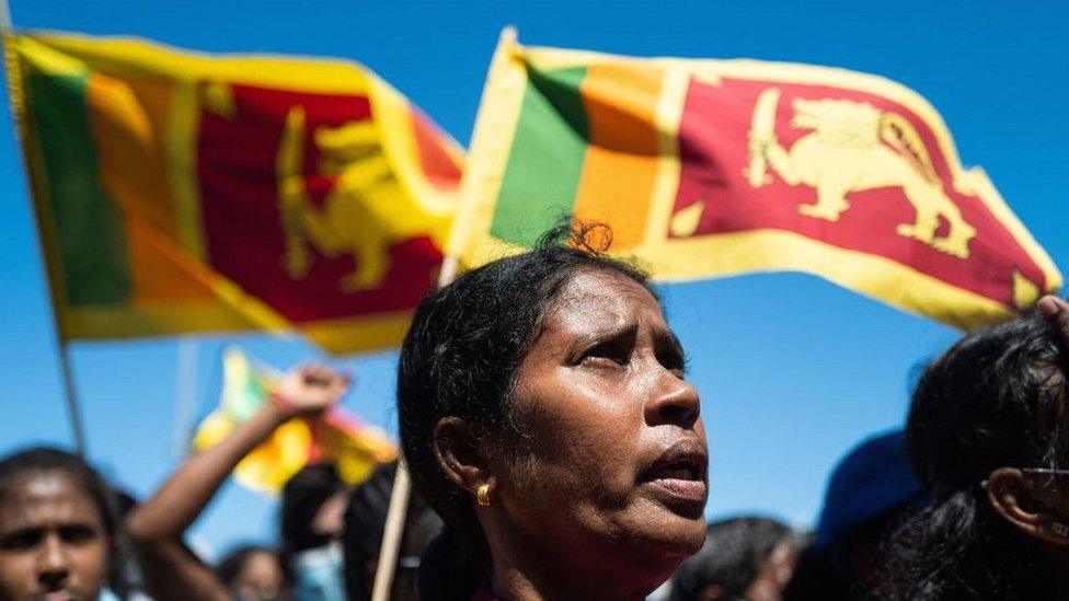 People shout slogans at an anti-government demonstration in Colombo.