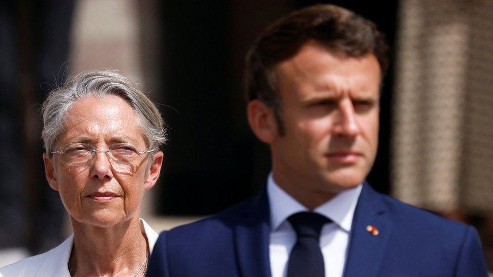 French President Emmanuel Macron and French Prime Minister Elisabeth Borne attend a ceremony