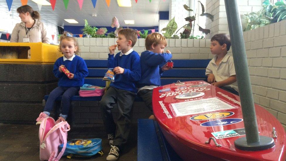 Pupils wait at Fishguard harbour