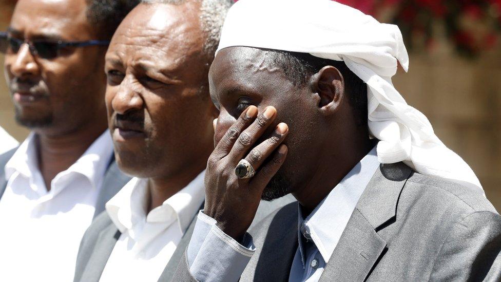 Members of African communities in Yemen gather outside the headquarters of the UN migration agency in Sanaa, Yemen (13 March 2021)