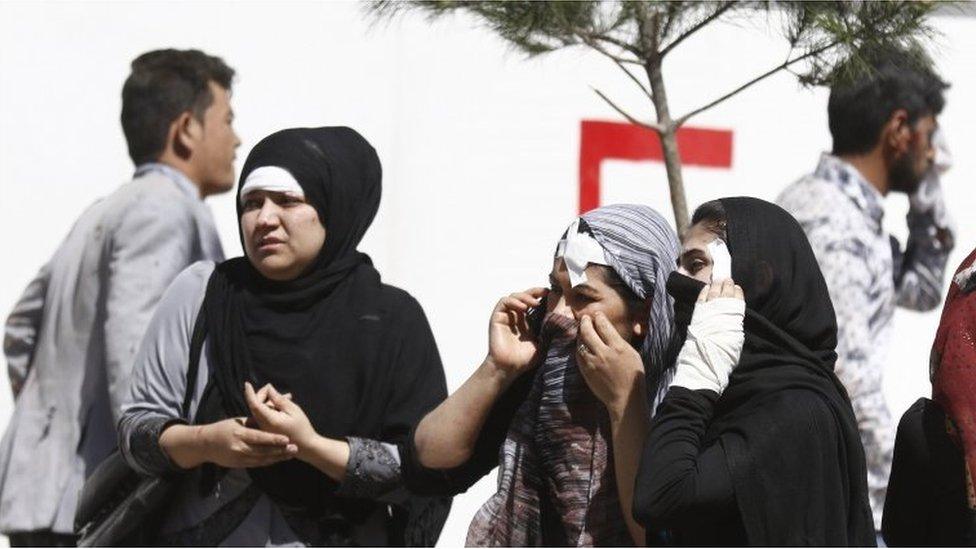 People injured in a suicide bomb attack receive first aid at the scene of attack in Kabul, Afghanistan, 31 May 2017.