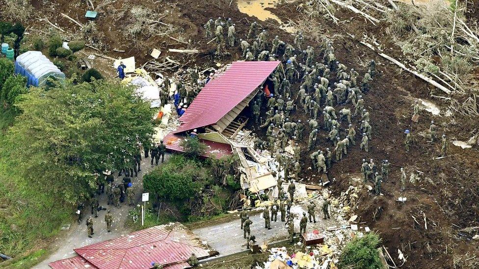 Rescue workers in the town of Atsuma