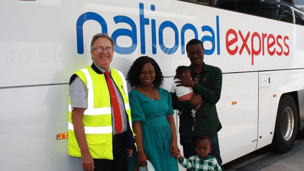 The family and driver outside the bus