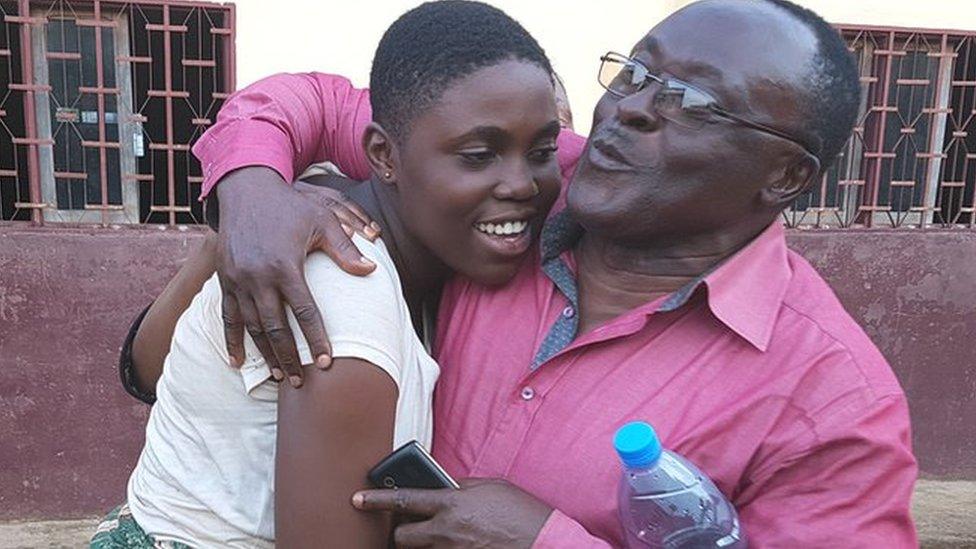 Daughter hugging her father