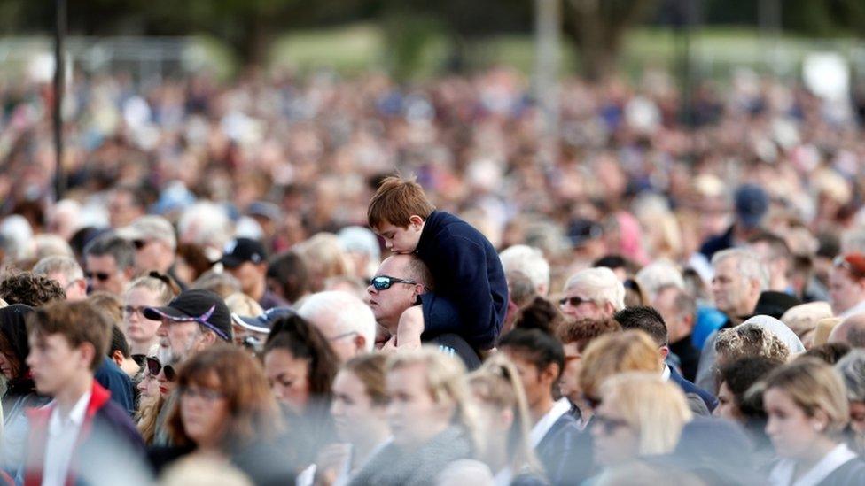 A view of the crowd, including a young boy on his father's shoulders, in Hagley Park on March 29