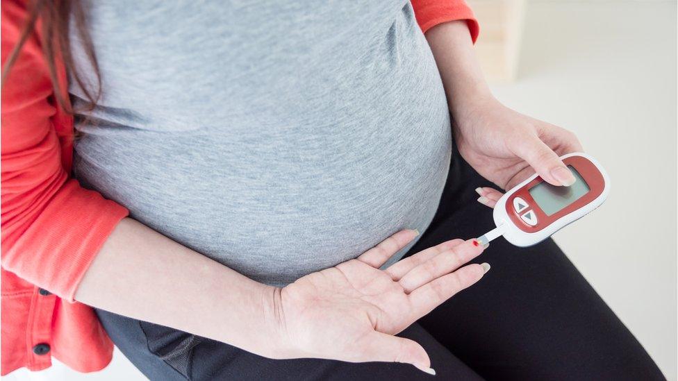 pregnant mum checks insulin levels