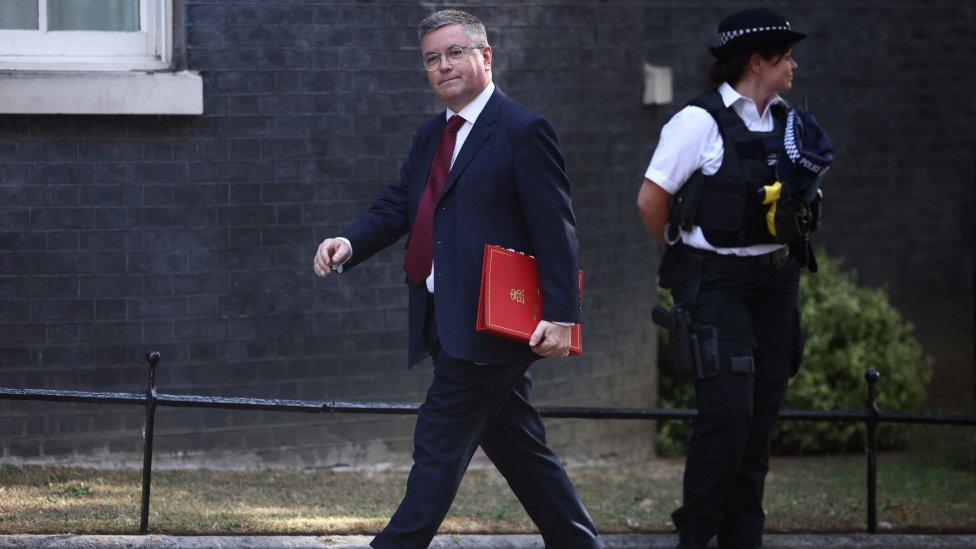 Sir Robert Buckland walking outside No.10 Downing Street