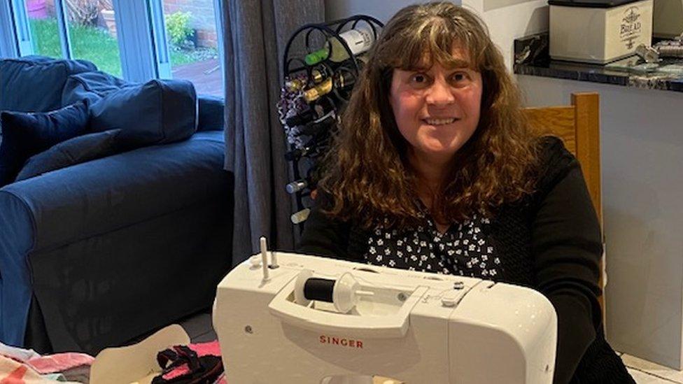 Ruth Smith at a sewing machine