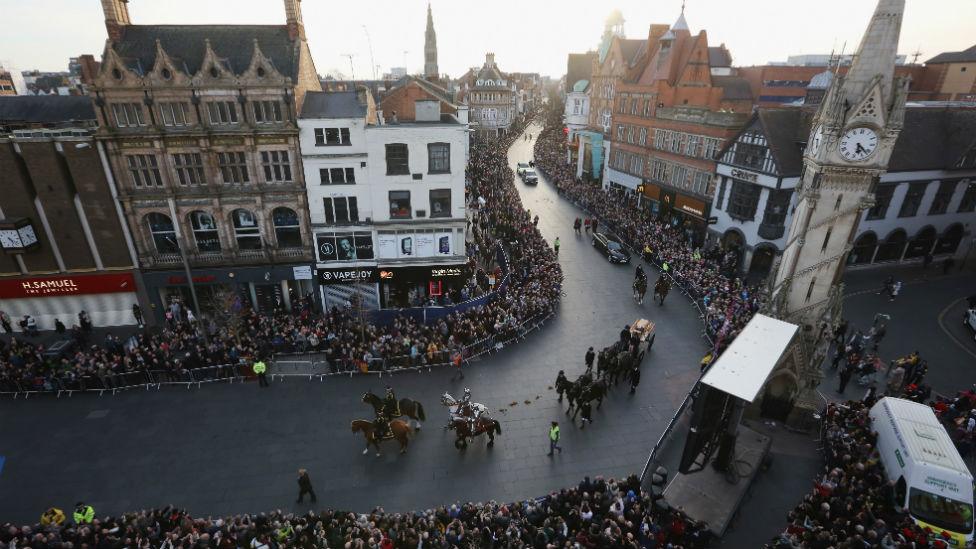 The coffin containing the remains of King Richard III carried through Leicester