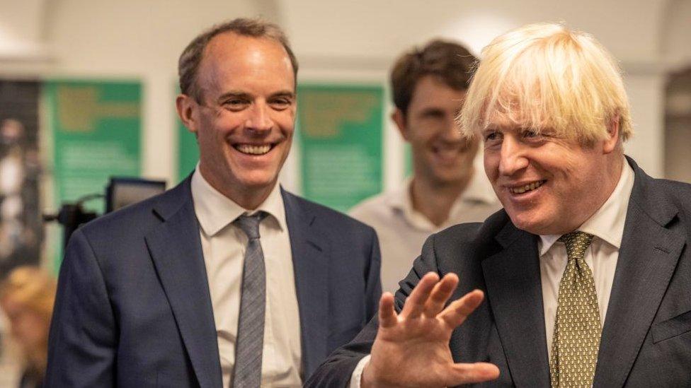 Former prime minster Boris Johnson is pictured alongside then-foreign justice secretary Dominic Raab in 2021