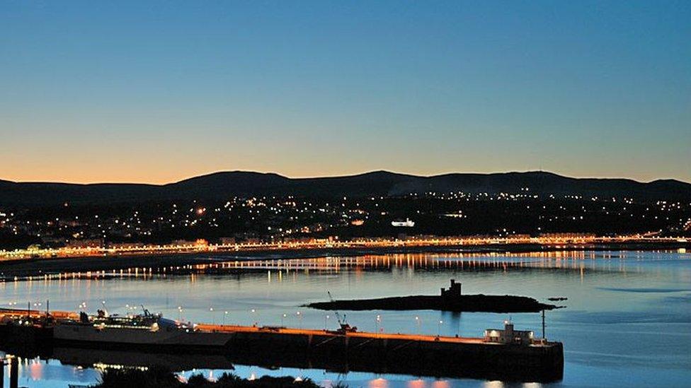 Douglas Bay at night with promenade lights visible