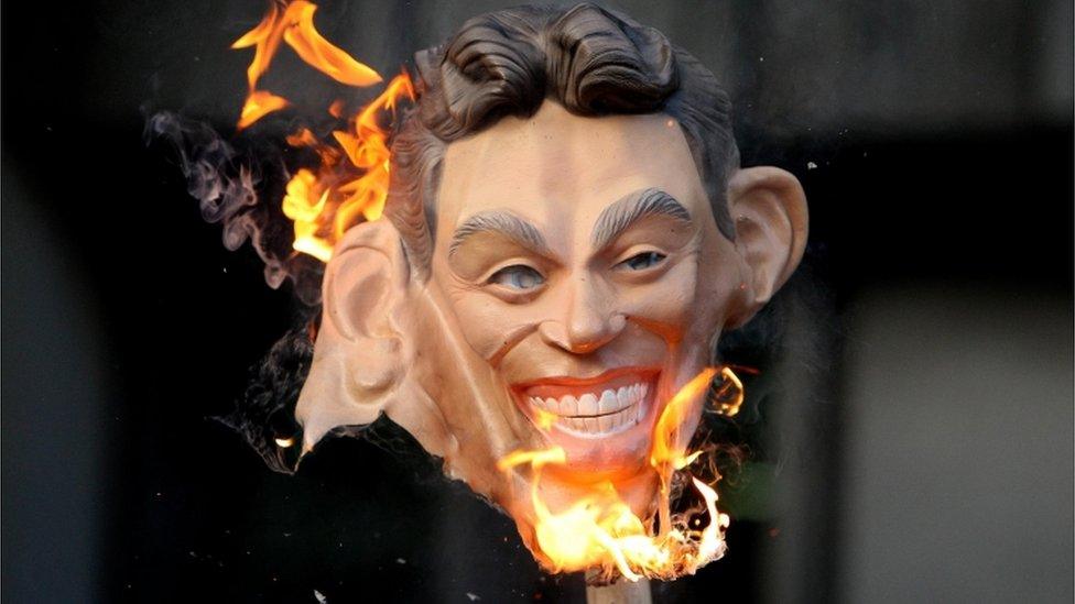 Burning Tony Blair mask outside the Iraq Inquiry, at the Queen Elizabeth II Conference Centre, Westminster, November 2009