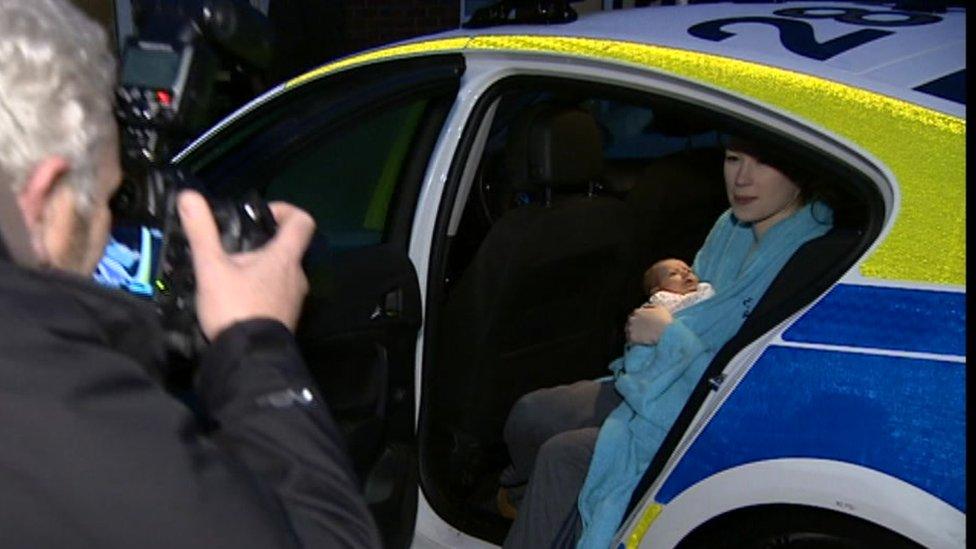 Mum and baby in police car