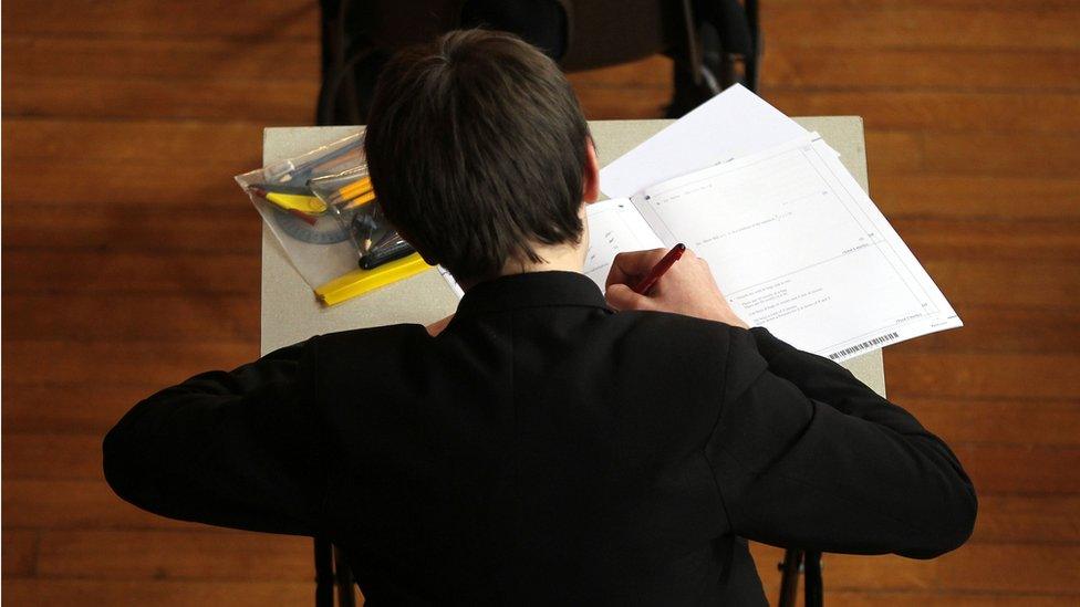 A school pupil taking an exam