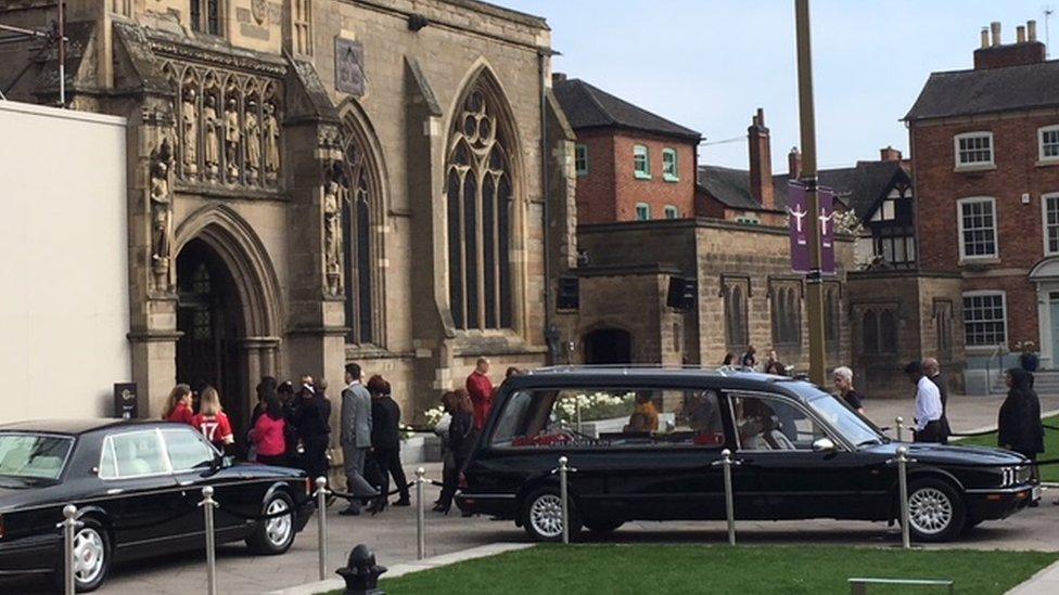 Mourners walking into Leicester cathedral for the Ragoobeer funeral