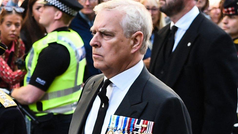 Prince Andrew walking behind hearse