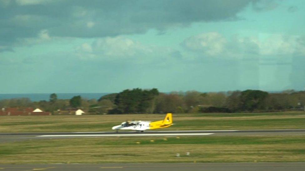 The plane leaving the airport