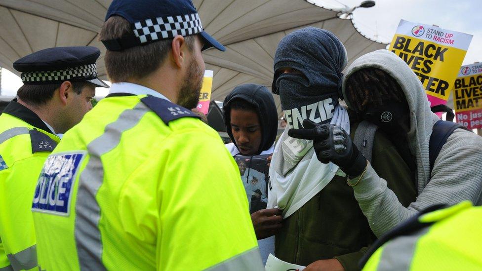 Protesters confront police