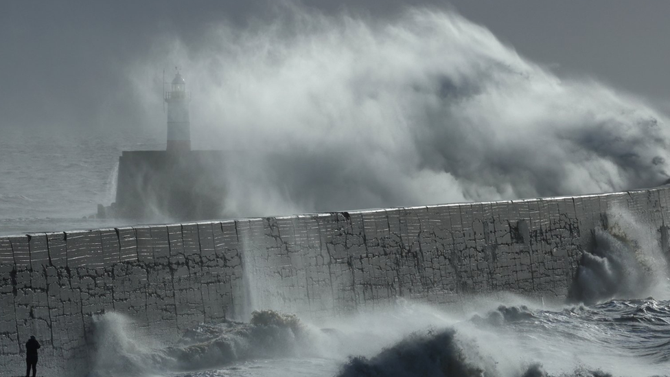 Waves bash against Newhaven harbour in Sussex amid fierce winds brought on by Storm Isha