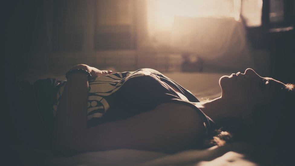 woman lying in bed