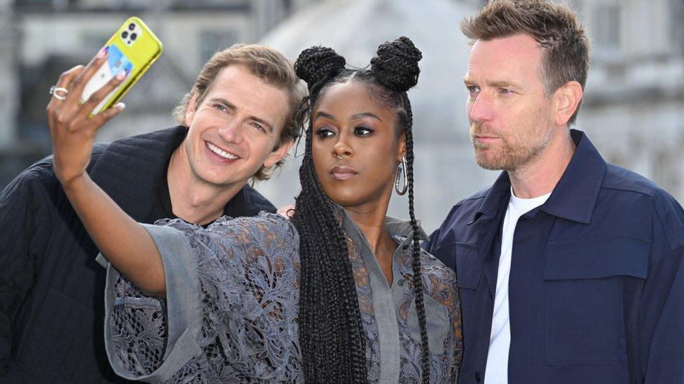 Hayden Christensen with Kenobi co-stars Moses Ingram and Ewan McGregor, Moses is taking a selfie with the other actors.