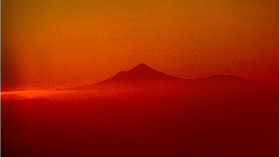 Mount Taranaki at sunset, taken about 80 miles away on the slopes of Mount Ruapehu in the Tongariro National Park