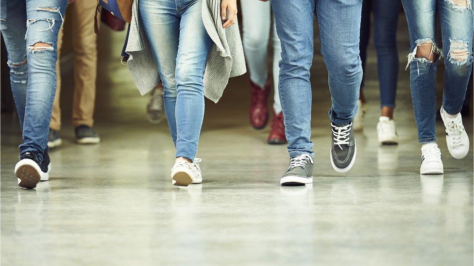 Students walk through corridor