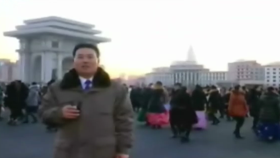 North Korean citizens dance in the streets in central Pyongyang